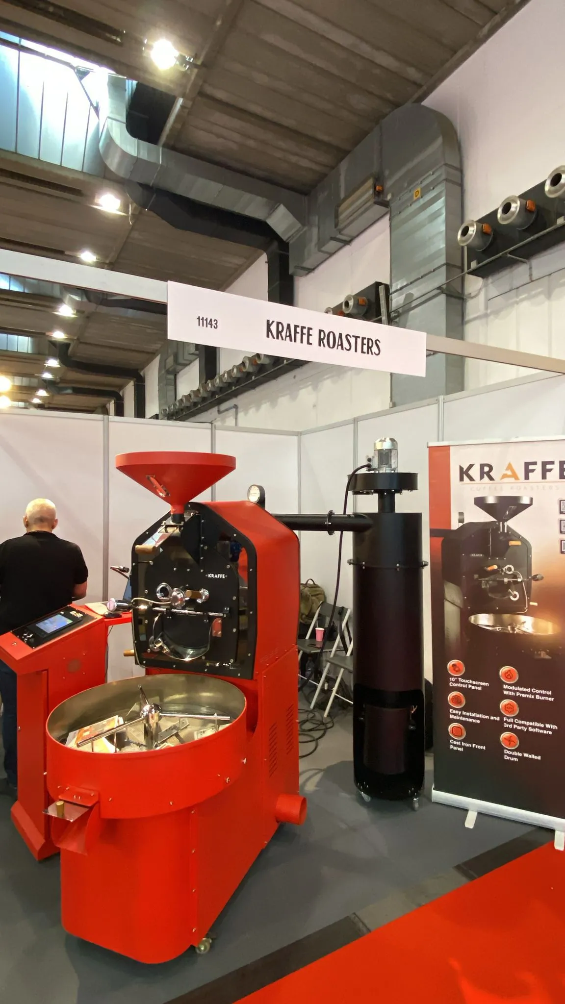 Close-up of the red drum coffee roaster